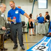 Seymour Padnos speaking with an engineering student.